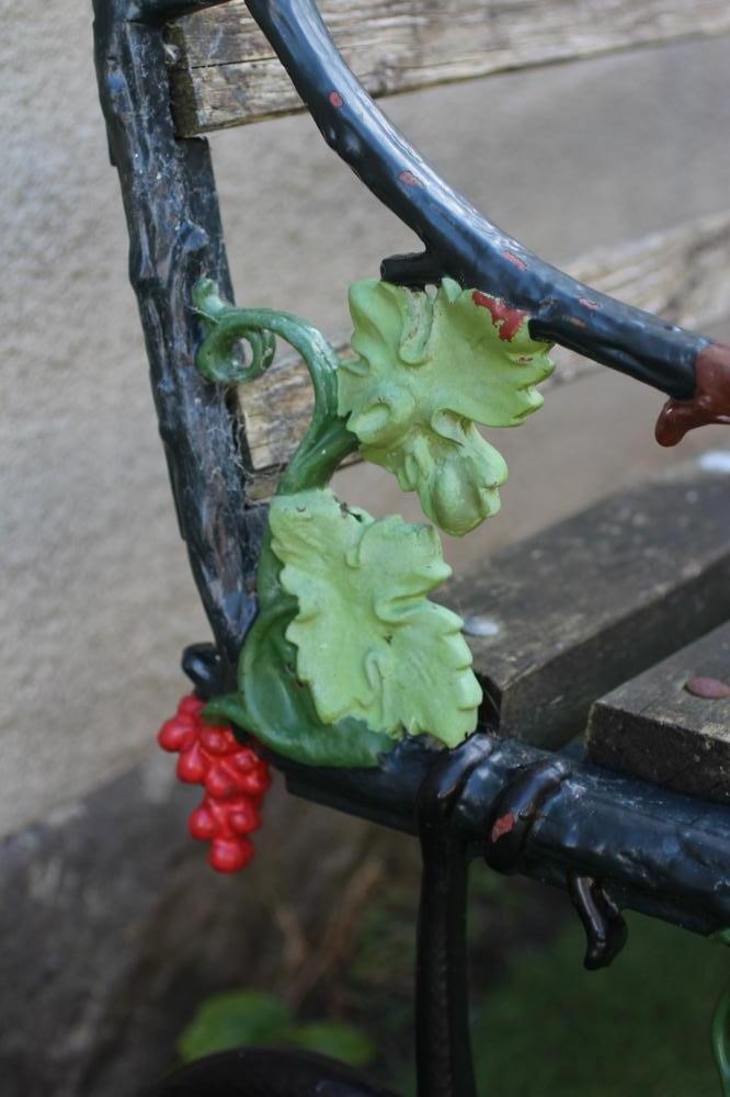 A VICTORIAN CAST IRON BENCH in Grape and Serpent pattern, with slatted wood back and seat, 61 1/2" x Image