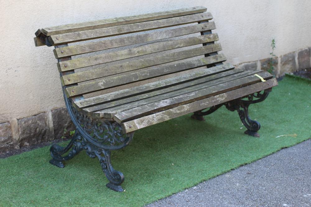 A VICTORIAN PARK BENCH with pierced scroll work ends and slatted wood seat and back, 60" x 16" x 32 Image