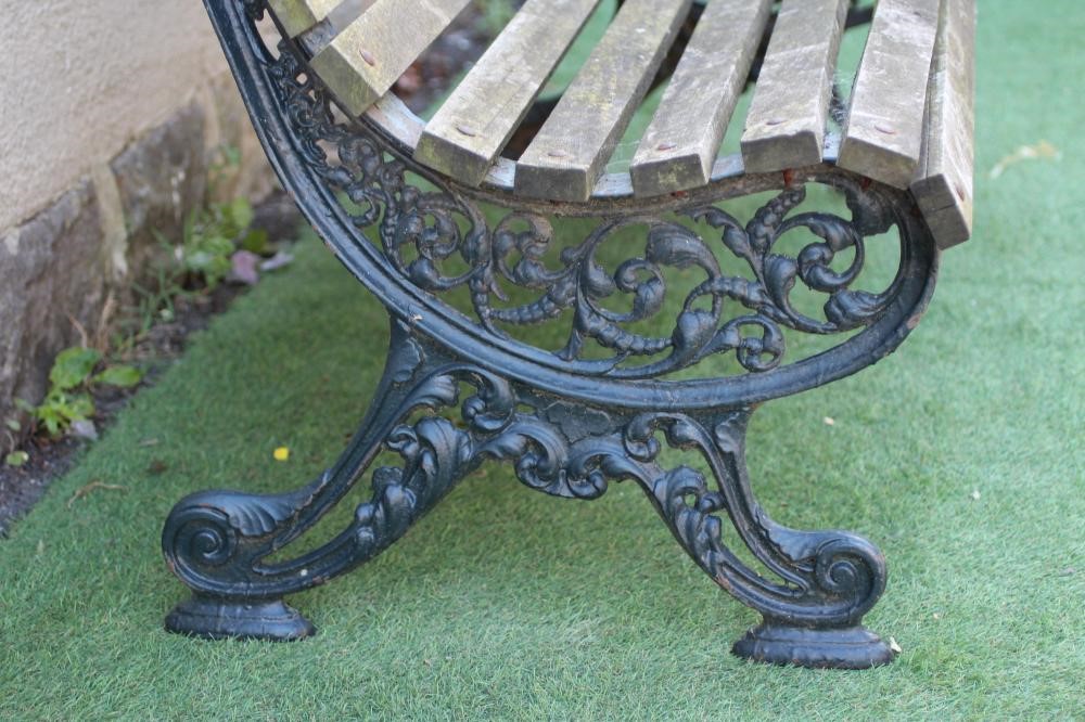 A VICTORIAN PARK BENCH with pierced scroll work ends and slatted wood seat and back, 60" x 16" x 32 Image