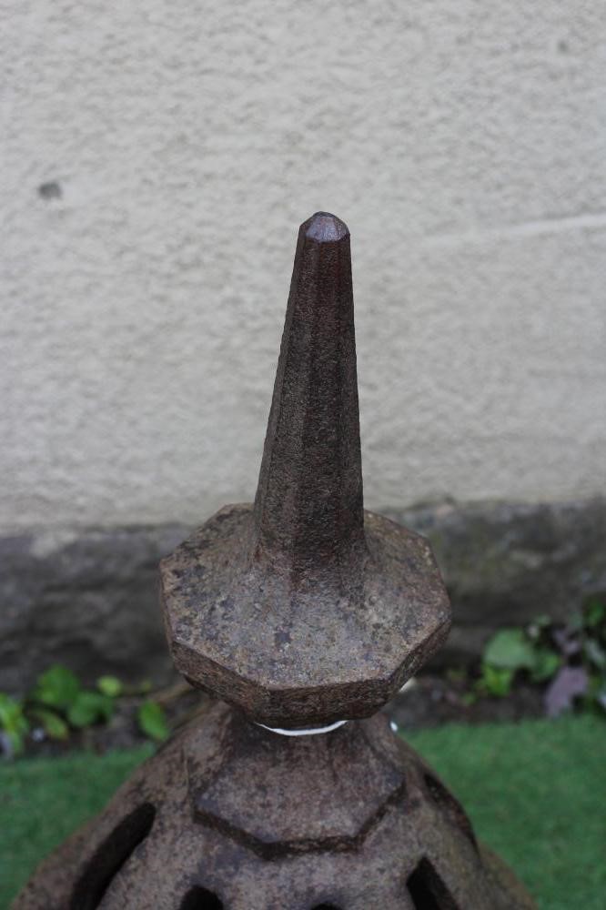 A VICTORIAN CAST IRON AIR VENT of pierced cylindrical form, the domed top surmounted by a faceted Image