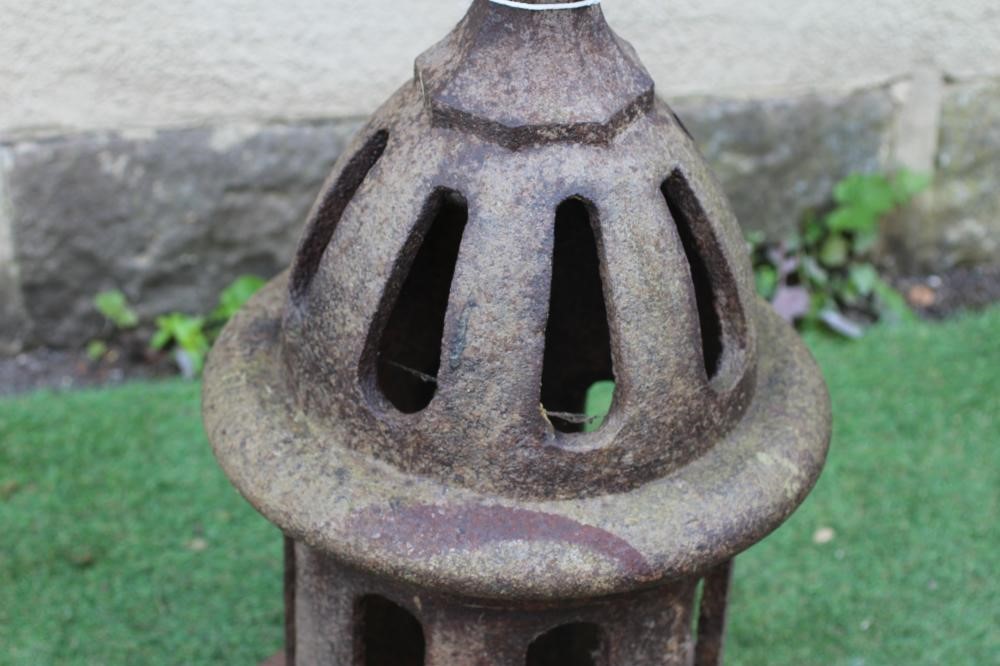 A VICTORIAN CAST IRON AIR VENT of pierced cylindrical form, the domed top surmounted by a faceted Image