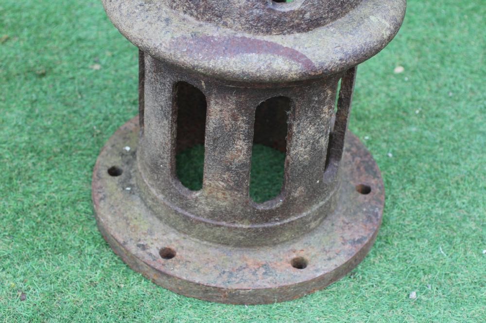 A VICTORIAN CAST IRON AIR VENT of pierced cylindrical form, the domed top surmounted by a faceted Image
