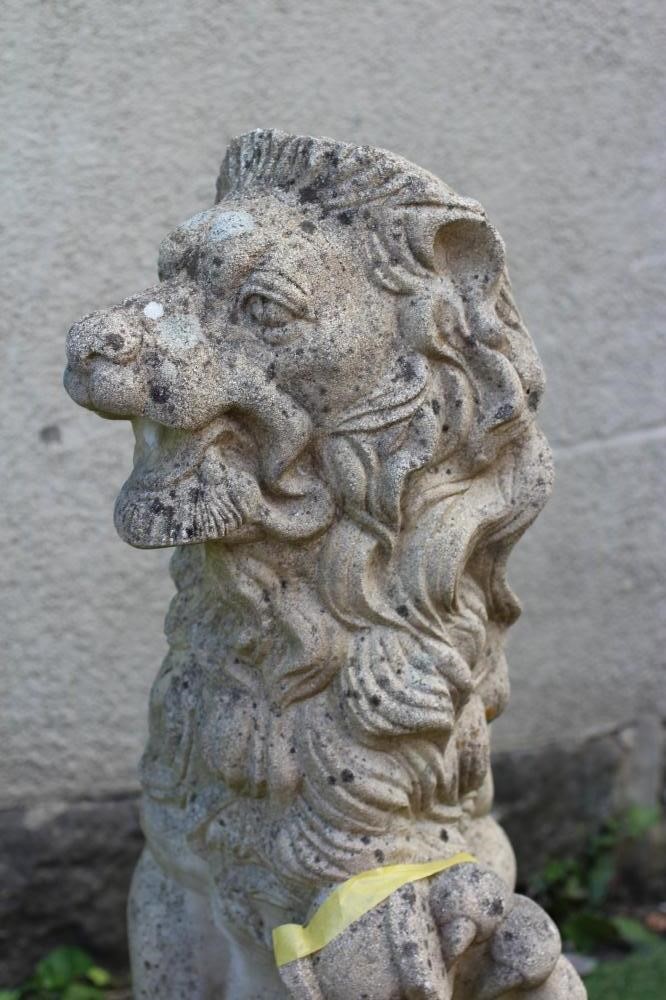 A CAST STONE HERALDIC LION SEJANT holding a shield, 12" x 38 1/2" (Est. plus 24% premium inc. VAT) Image