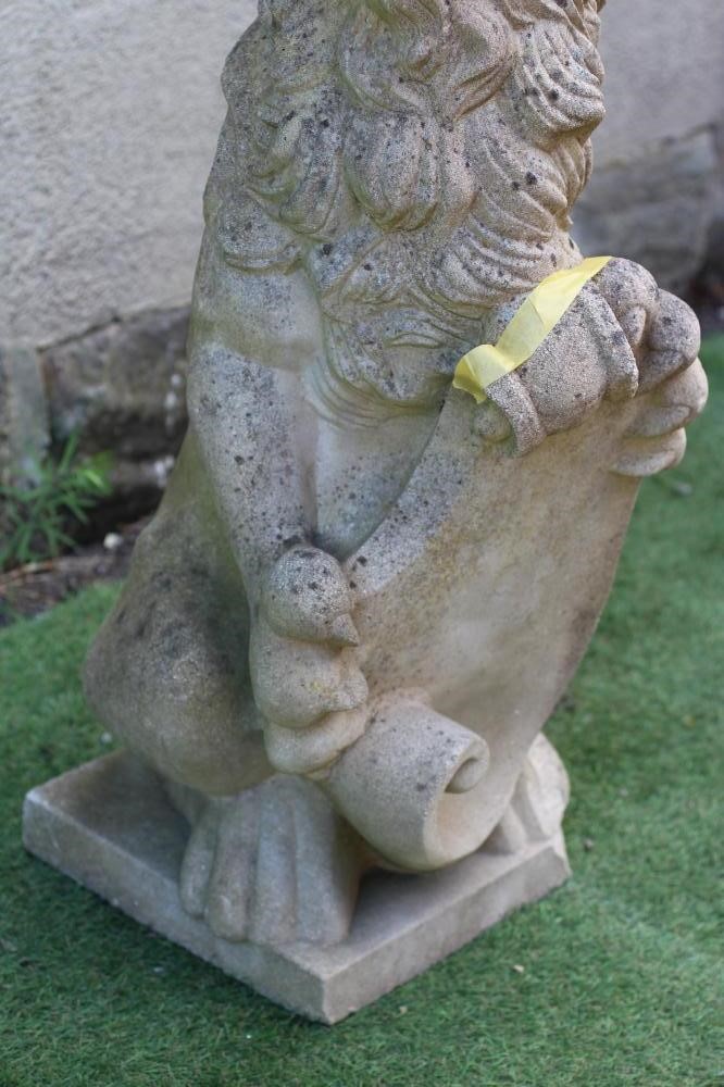 A CAST STONE HERALDIC LION SEJANT holding a shield, 12" x 38 1/2" (Est. plus 24% premium inc. VAT) Image