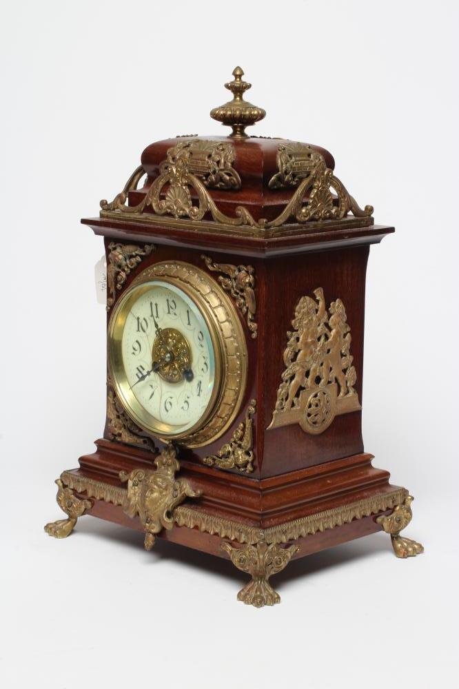A FRENCH MAHOGANY AND BRASS TABLE CLOCK Image