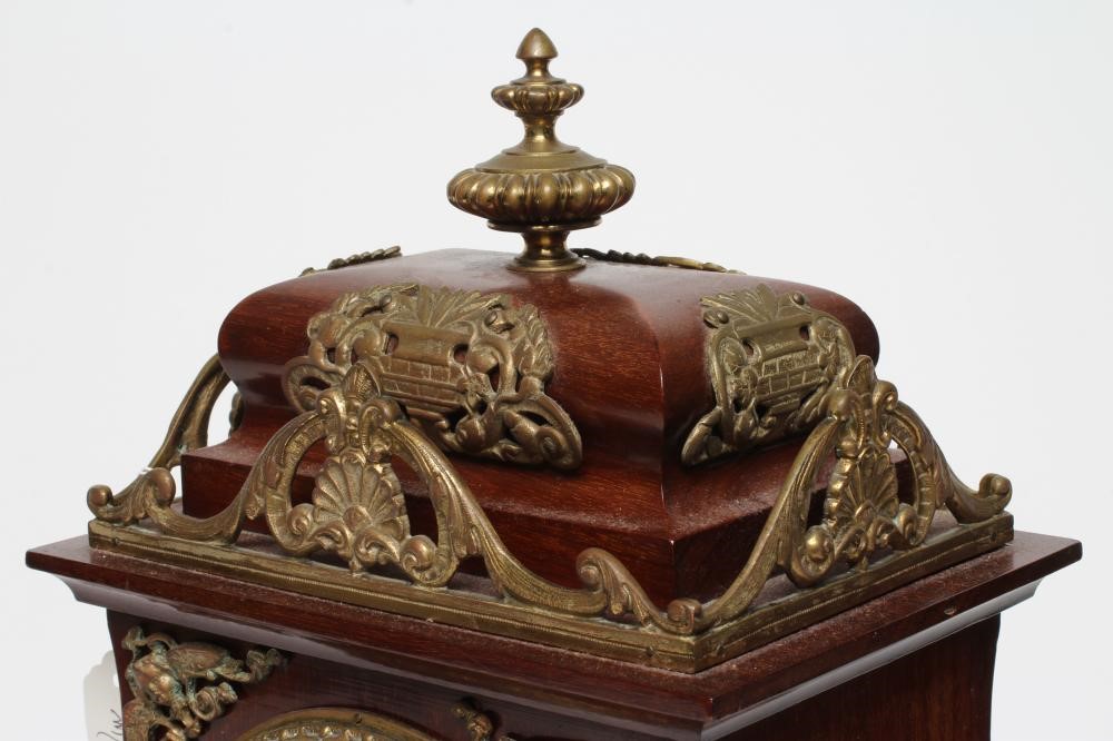 A FRENCH MAHOGANY AND BRASS TABLE CLOCK Image