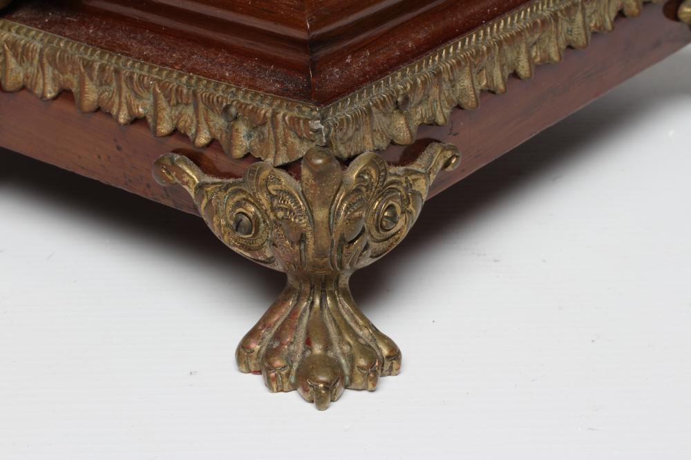 A FRENCH MAHOGANY AND BRASS TABLE CLOCK Image