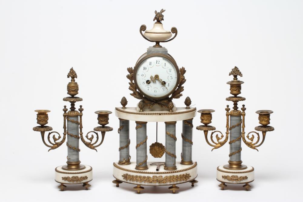 A FRENCH GILT METAL AND WHITE MARBLE CLOCK GARNITURE Image