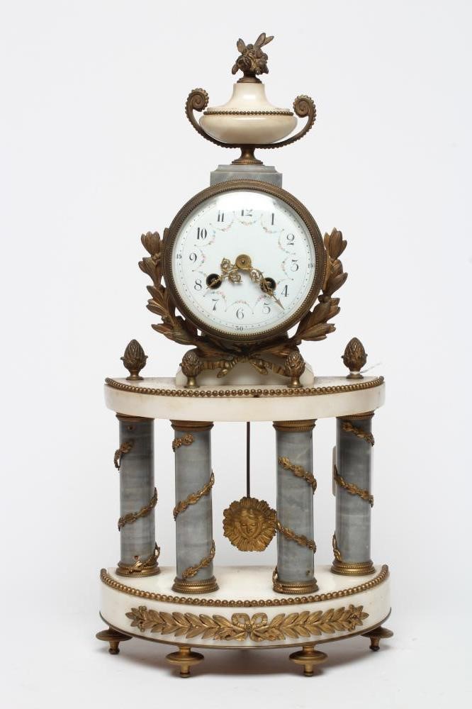 A FRENCH GILT METAL AND WHITE MARBLE CLOCK GARNITURE Image