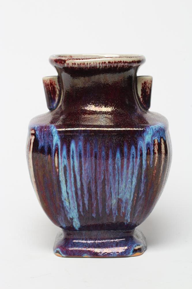 A CHINESE STONEWARE ARCHAISTIC VASE of square baluster form with two lug handles, in a streaky Image