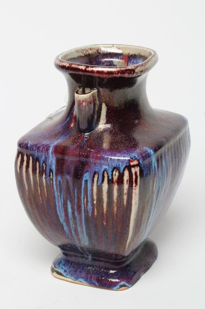 A CHINESE STONEWARE ARCHAISTIC VASE of square baluster form with two lug handles, in a streaky Image