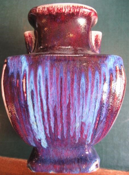 A CHINESE STONEWARE ARCHAISTIC VASE of square baluster form with two lug handles, in a streaky Image