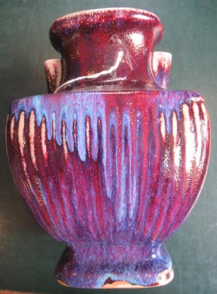 A CHINESE STONEWARE ARCHAISTIC VASE of square baluster form with two lug handles, in a streaky Image