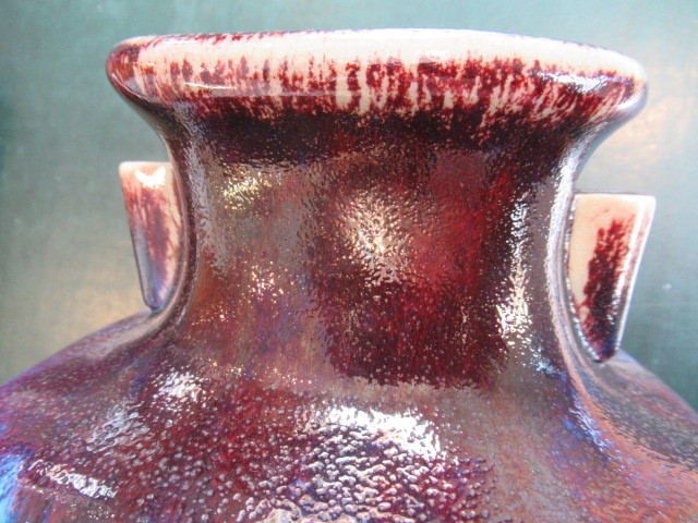 A CHINESE STONEWARE ARCHAISTIC VASE of square baluster form with two lug handles, in a streaky Image