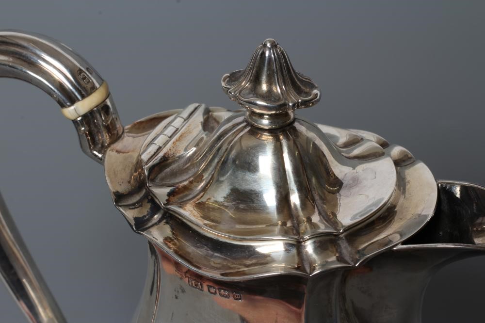 A SILVER HOT WATER JUG Image