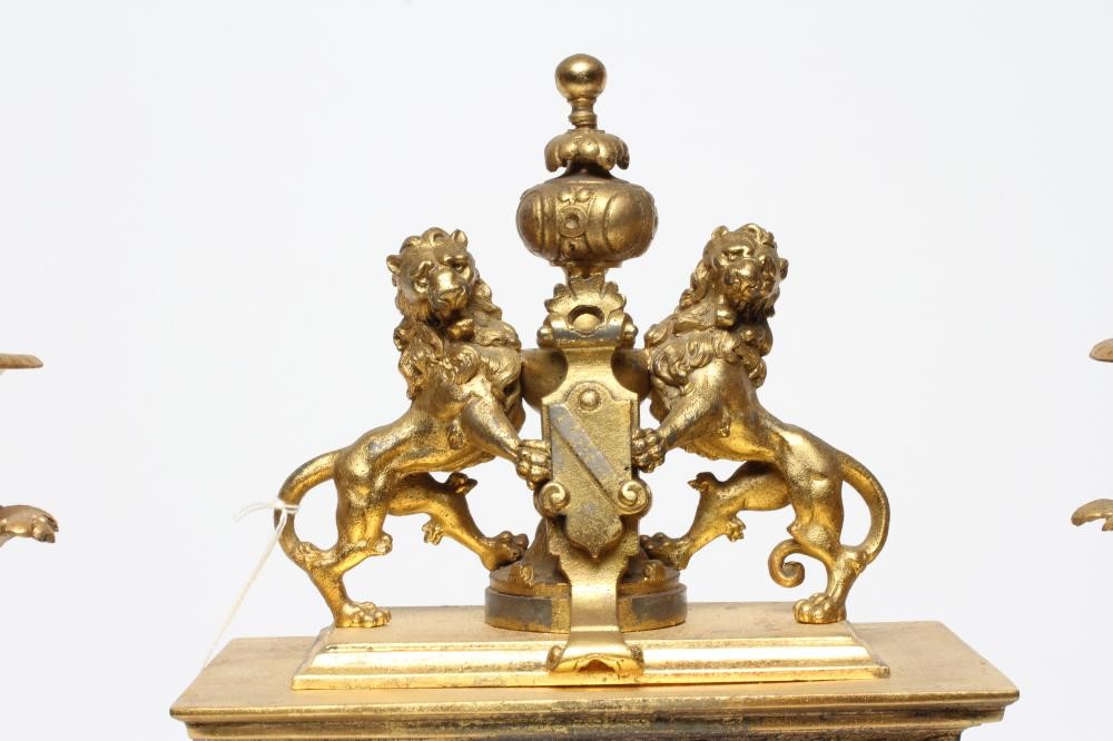 A FRENCH GILT METAL AND PORCELAIN CLOCK GARNITURE Image