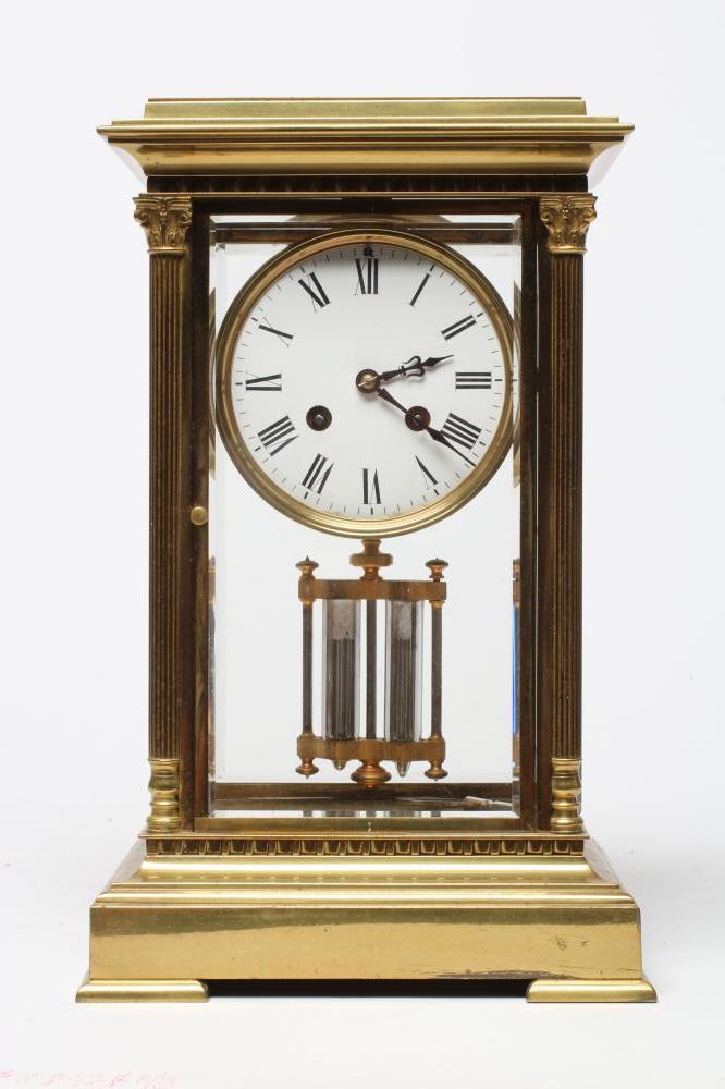 A FRENCH BRASS CASED FOUR GLASS TABLE CLOCK Image