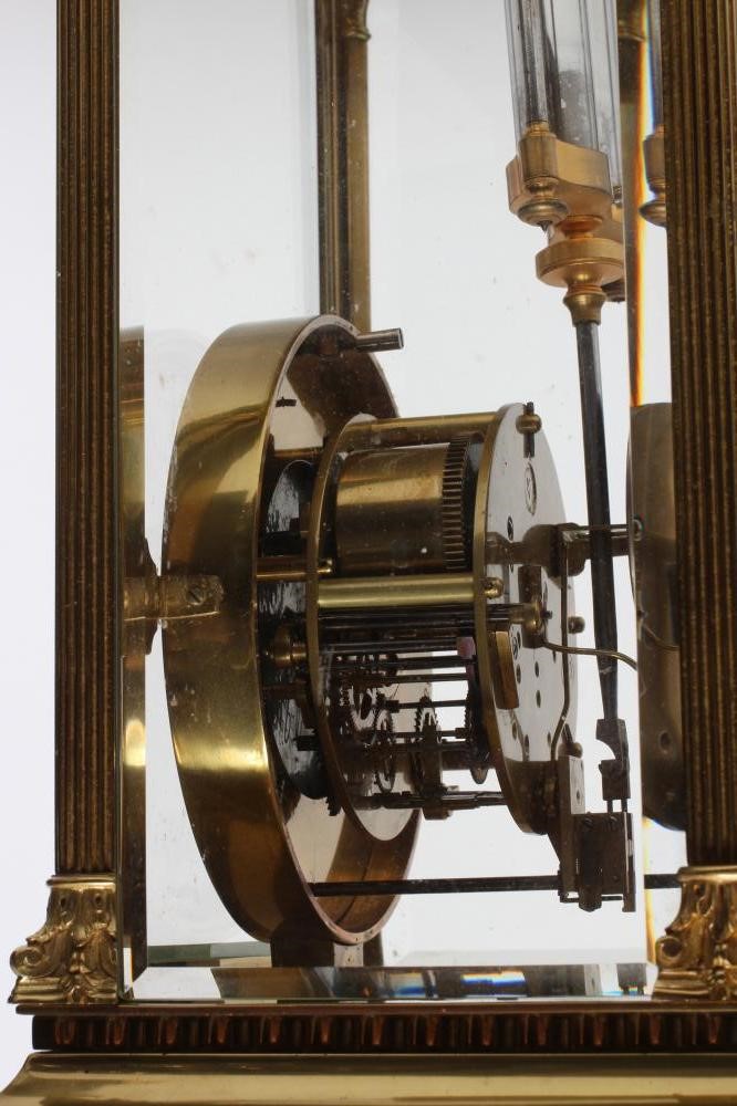 A FRENCH BRASS CASED FOUR GLASS TABLE CLOCK Image