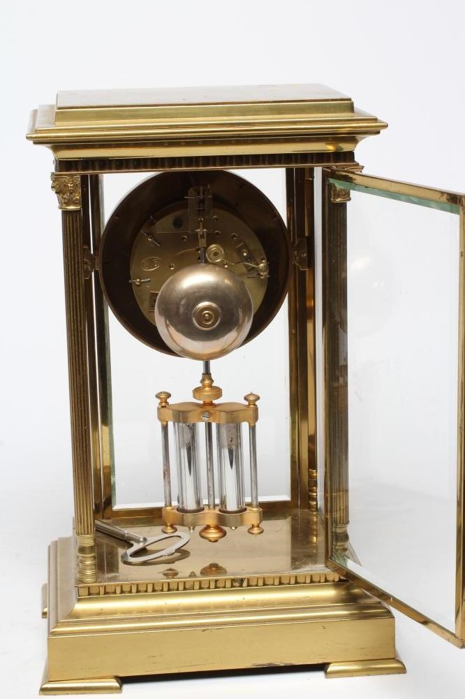 A FRENCH BRASS CASED FOUR GLASS TABLE CLOCK Image