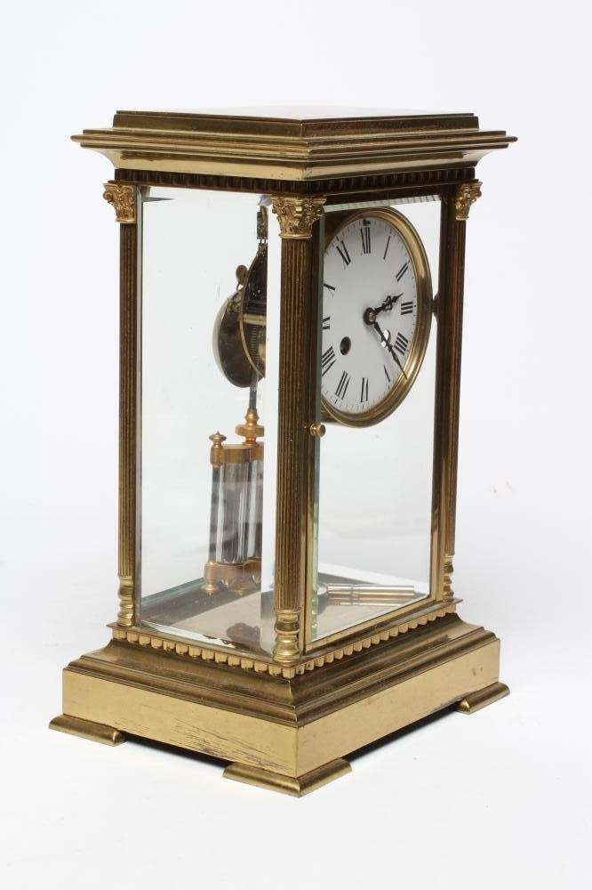 A FRENCH BRASS CASED FOUR GLASS TABLE CLOCK Image
