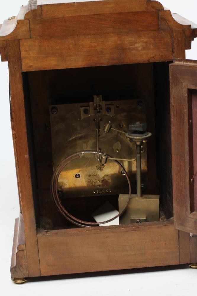 A LENZKIRCH LIGHT OAK AND WALNUT CASED TABLE CLOCK Image
