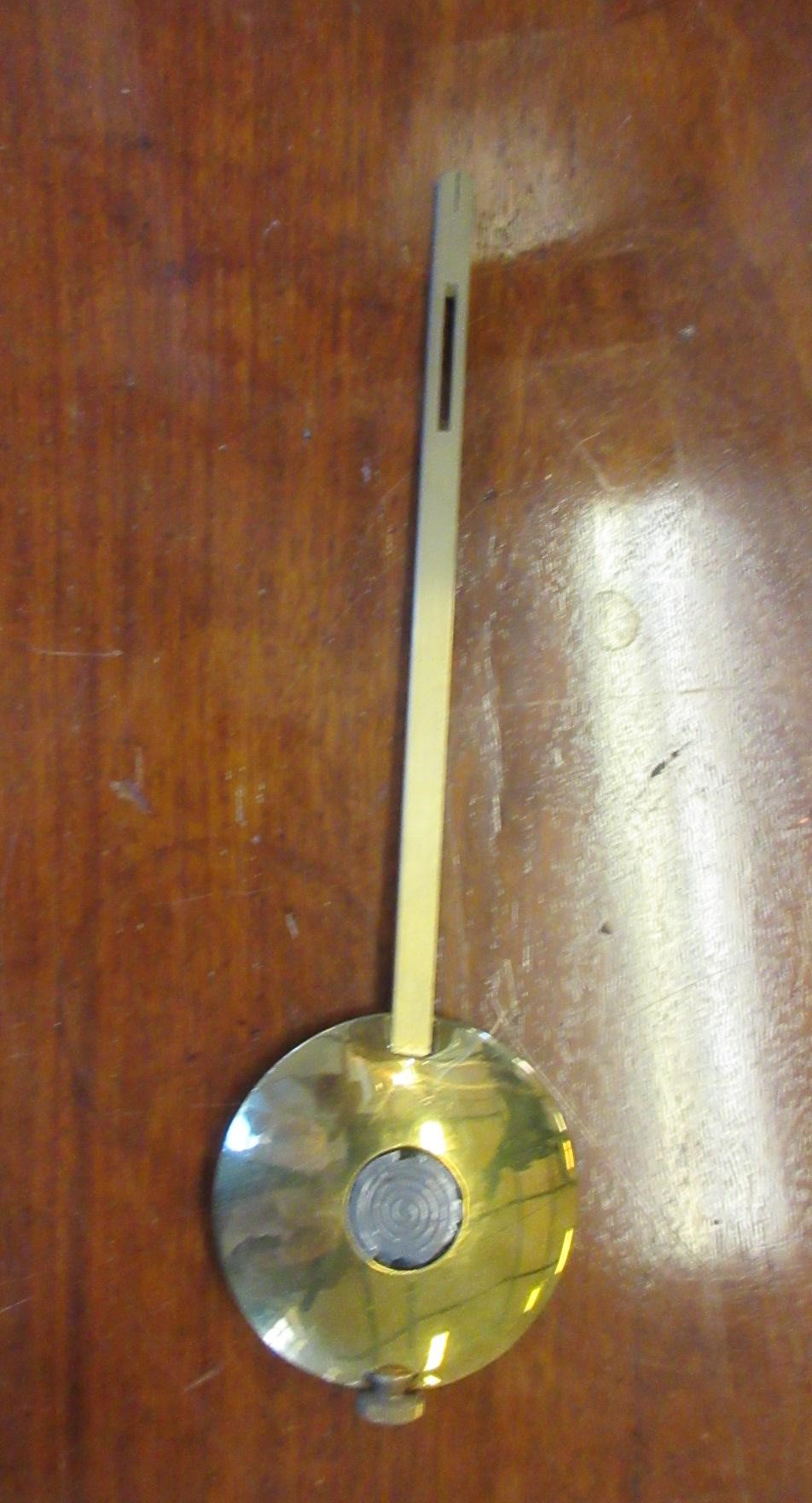 A LENZKIRCH LIGHT OAK AND WALNUT CASED TABLE CLOCK Image