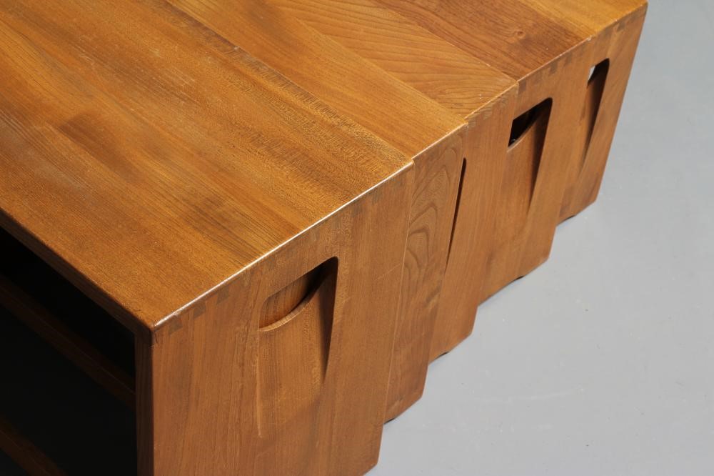 AN ERCOL LIGHT ELM NEST OF FIVE TABLES of oblong form, the solid sides pierced with inset loop Image