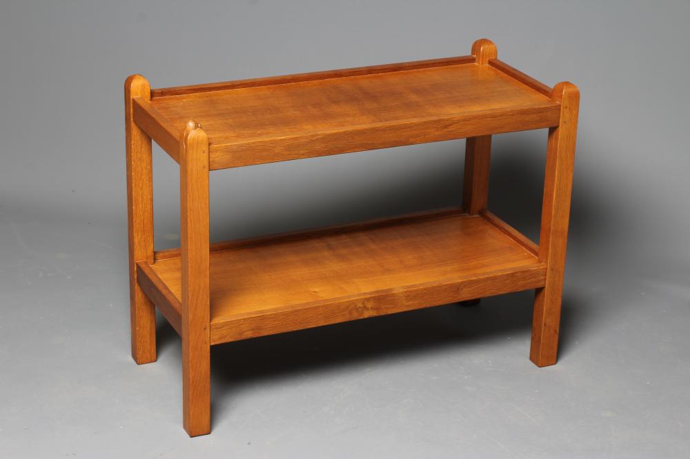 A ROBERT THOMPSON OAK TROLLEY of oblong two tier form, the square uprights with pointed finials, Image