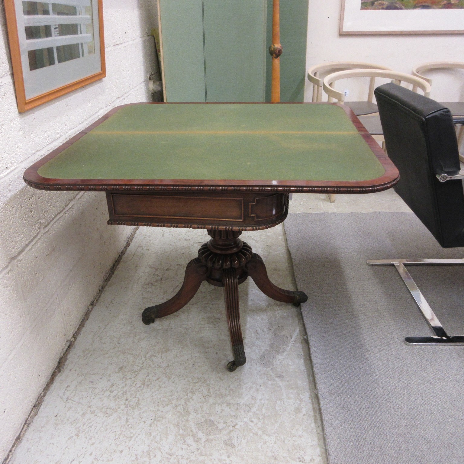 A ROBERT THOMPSON OAK TROLLEY of oblong two tier form, the square uprights with pointed finials, Image