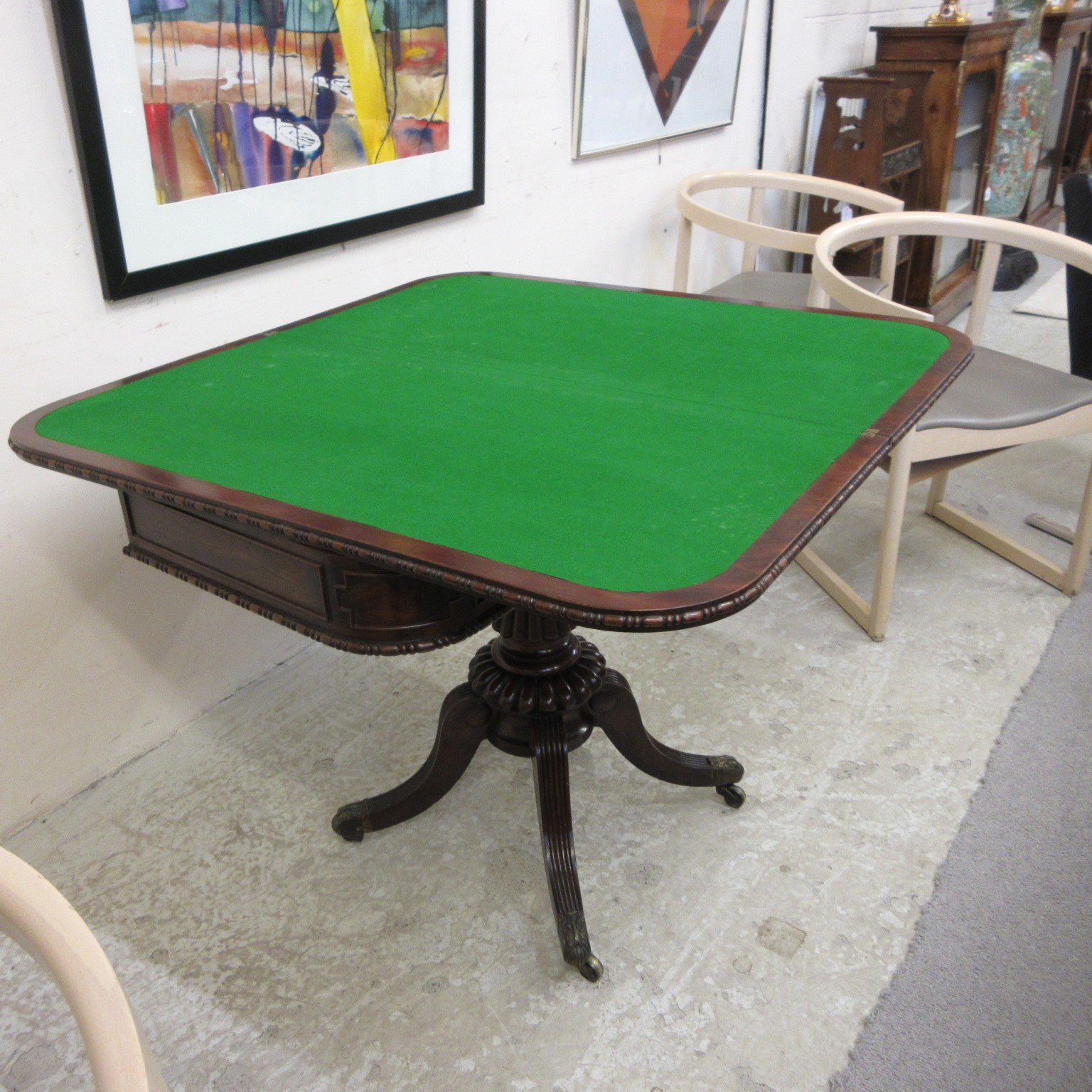 A ROBERT THOMPSON OAK TROLLEY of oblong two tier form, the square uprights with pointed finials, Image