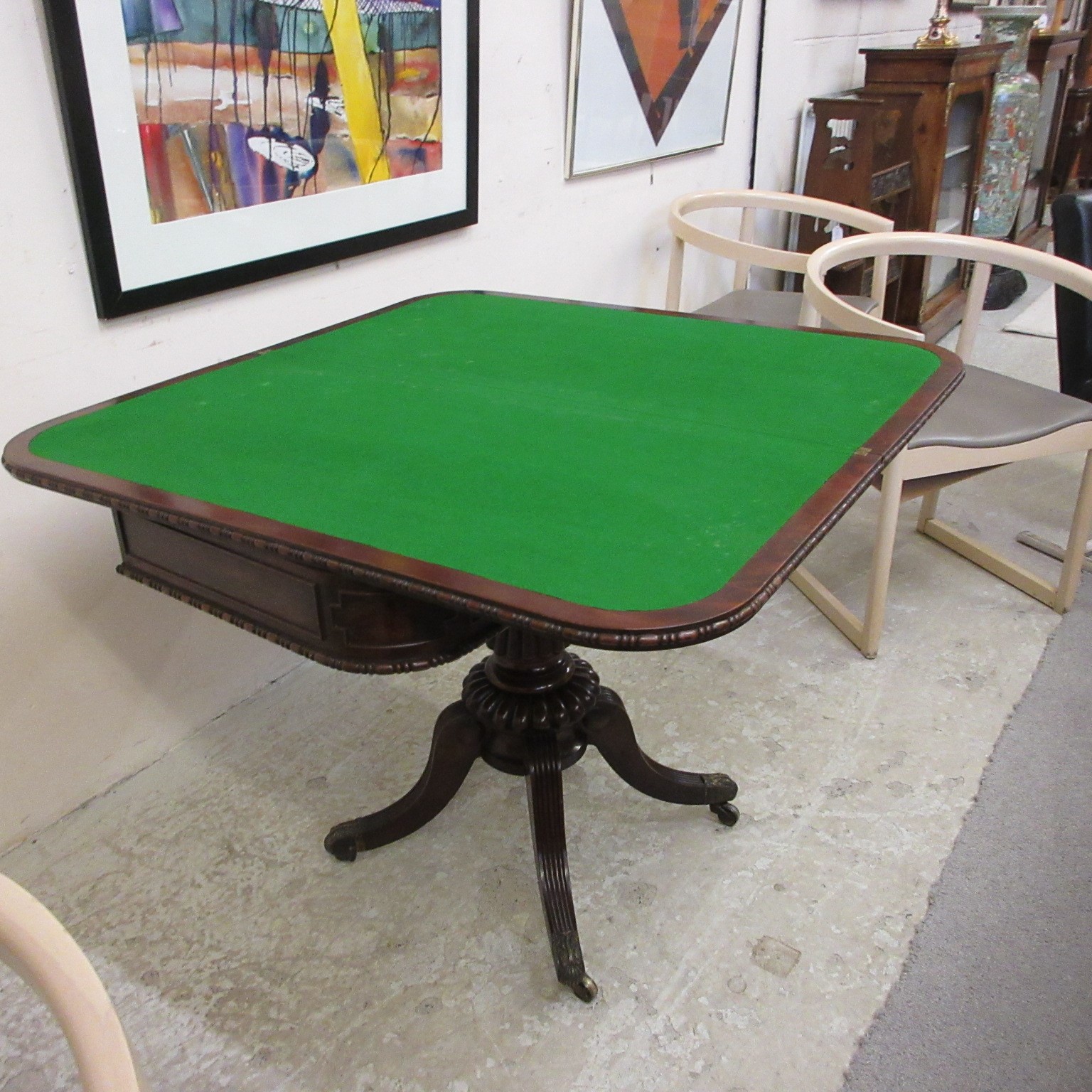 A ROBERT THOMPSON OAK TROLLEY of oblong two tier form, the square uprights with pointed finials, Image