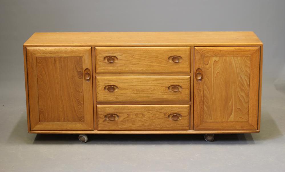 AN ERCOL LIGHT ELM SIDEBOARD Image