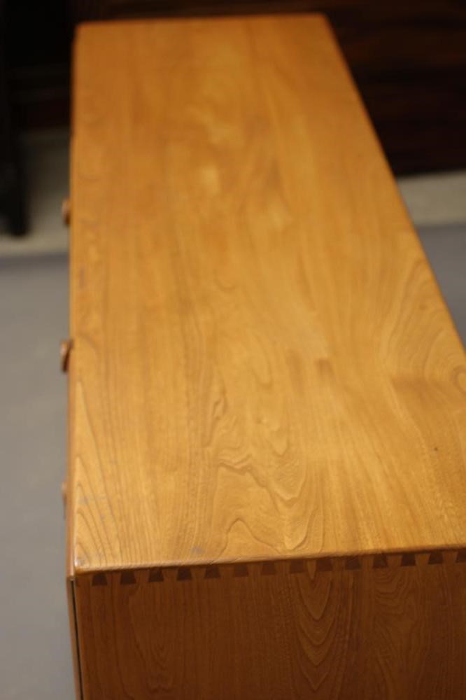 AN ERCOL LIGHT ELM SIDEBOARD Image