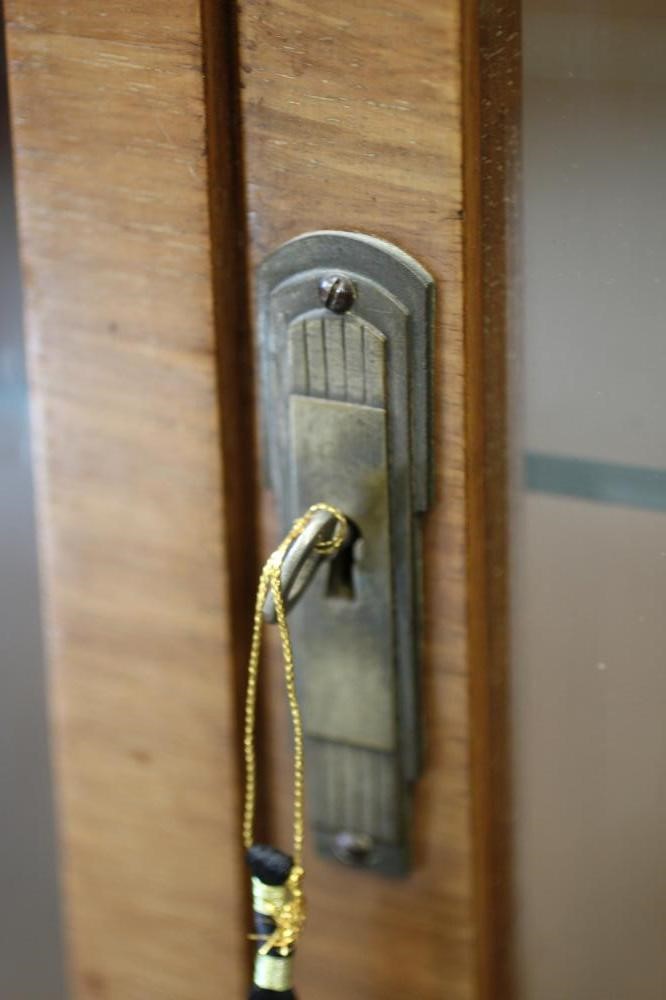 AN ART DECO WALNUT CABINET Image