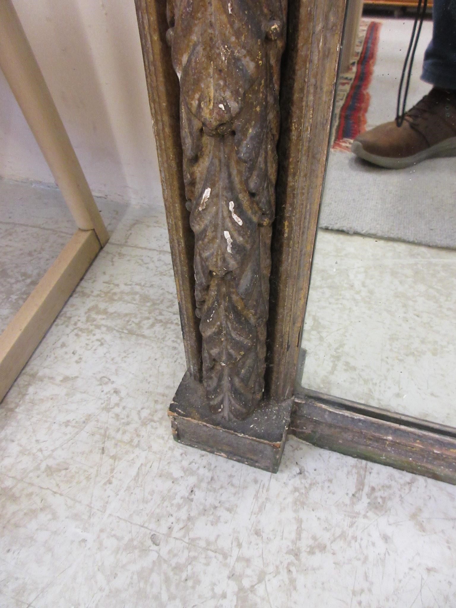 A REGENCY CARVED GILT GESSO PIER GLASS Image