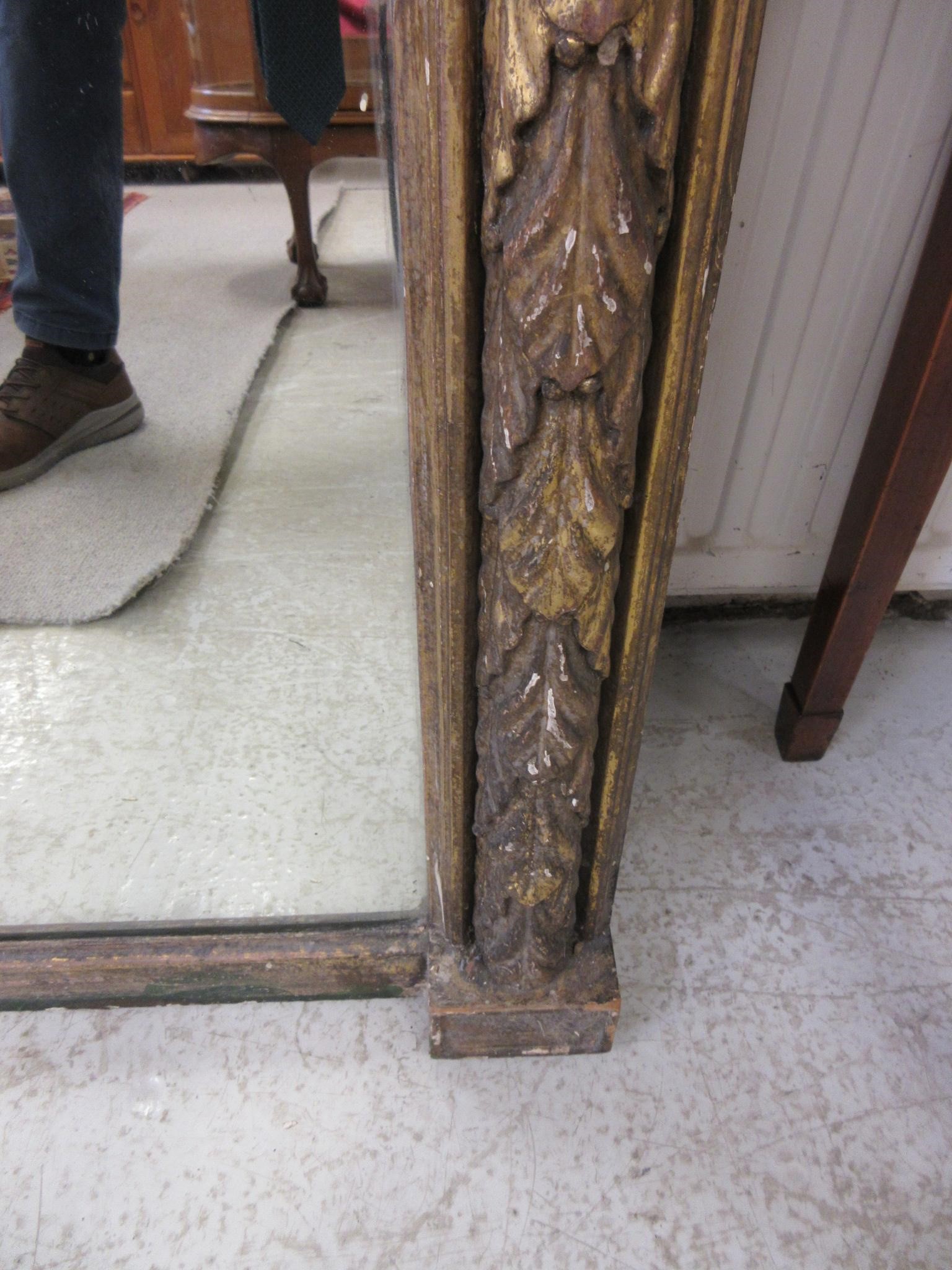 A REGENCY CARVED GILT GESSO PIER GLASS Image