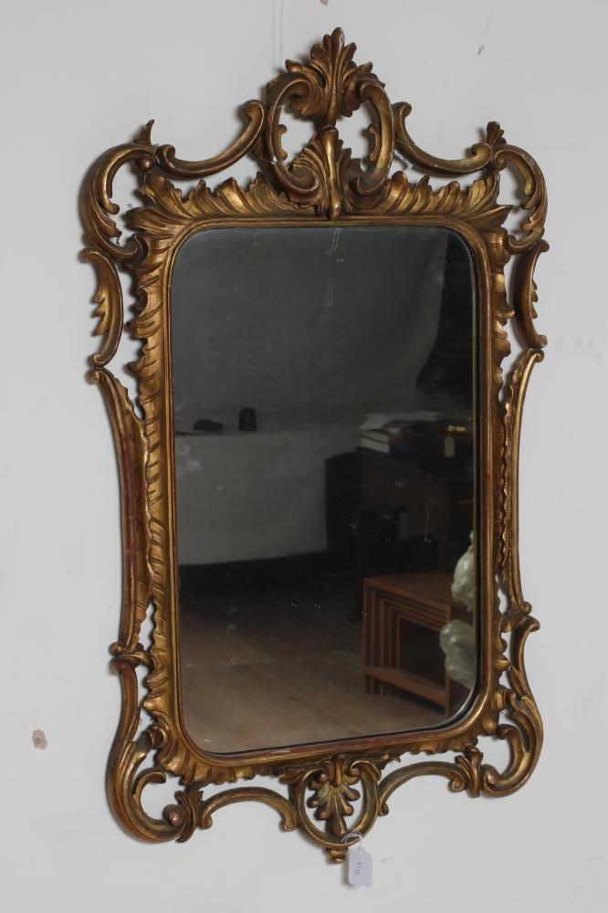 A CARVED AND GILT WOOD PIER GLASS of rococo design Image