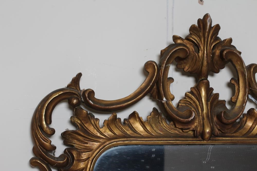 A CARVED AND GILT WOOD PIER GLASS of rococo design Image