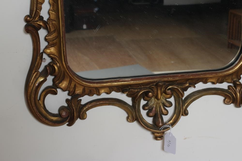 A CARVED AND GILT WOOD PIER GLASS of rococo design Image