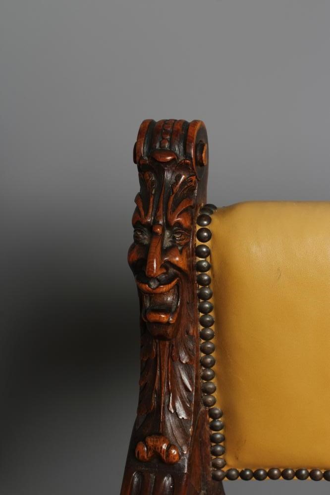 A CARVED WALNUT SAVONAROLA TYPE ARMCHAIR Image