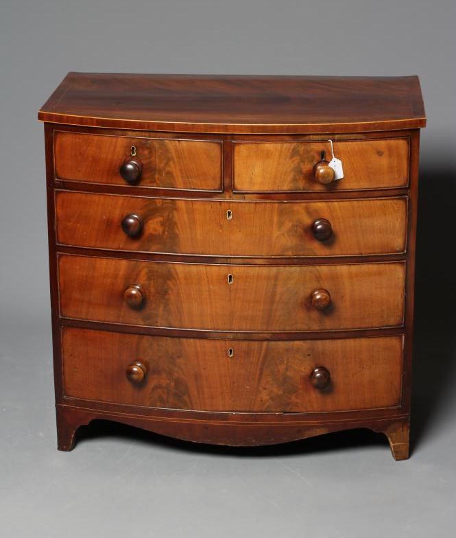 A SMALL MAHOGANY BOWED CHEST Image
