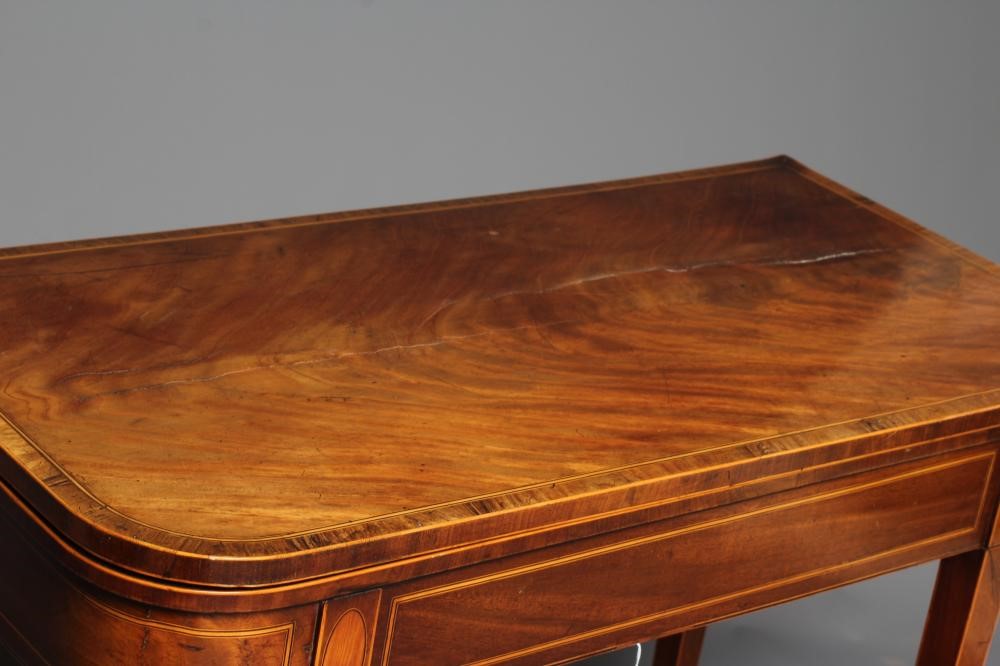 A GEORGIAN MAHOGANY FOLDING TEA TABLE Image