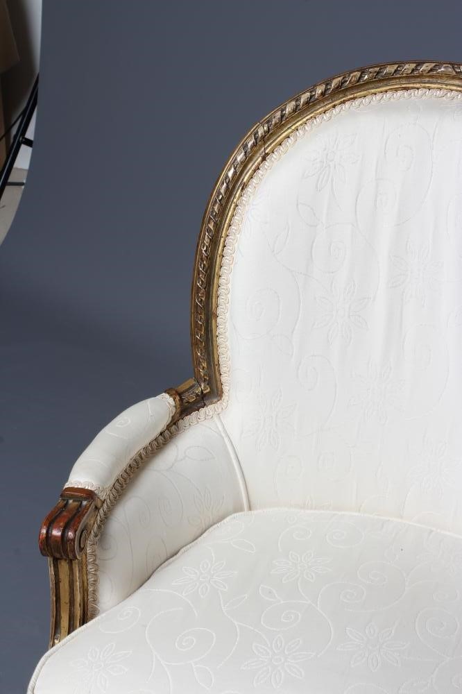 A LOUIS XV STYLE CARVED GILTWOOD FAUTEUIL Image