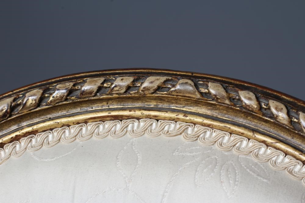 A LOUIS XV STYLE CARVED GILTWOOD FAUTEUIL Image