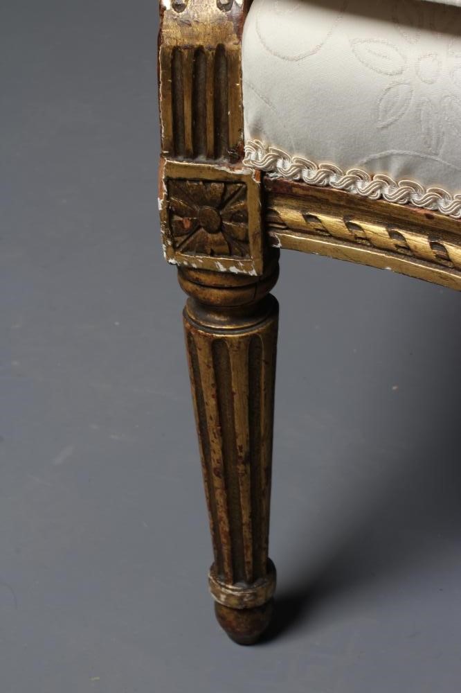 A LOUIS XV STYLE CARVED GILTWOOD FAUTEUIL Image