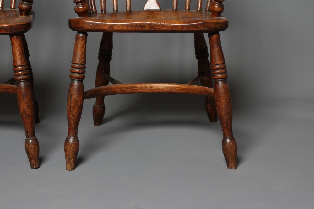 A PAIR OF ASH AND ELM LOW WINDSOR ARMCHAIRS Image