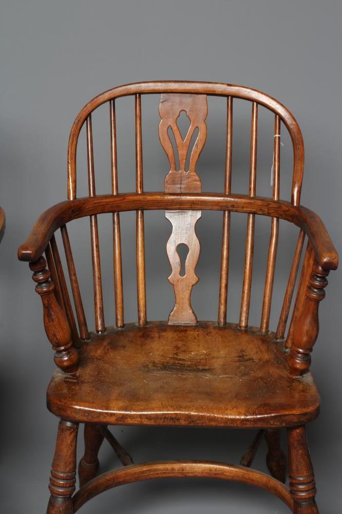 A PAIR OF ASH AND ELM LOW WINDSOR ARMCHAIRS Image