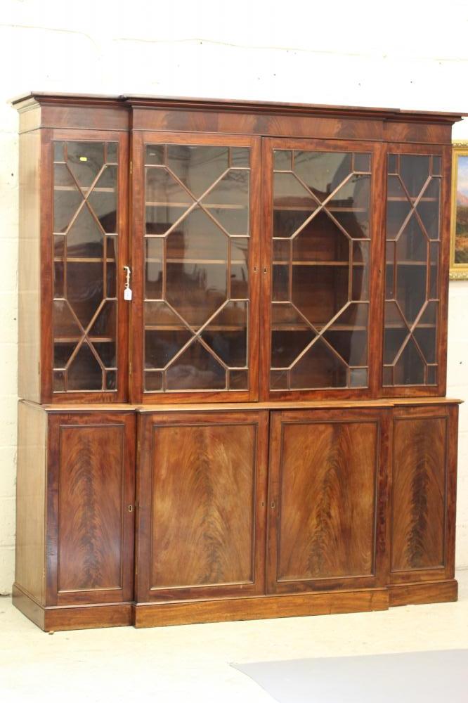 A MAHOGANY BREAKFRONT BOOKCASE Image