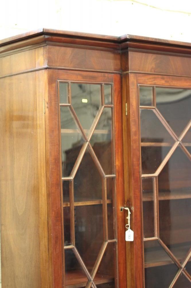A MAHOGANY BREAKFRONT BOOKCASE Image