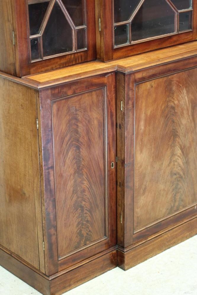 A MAHOGANY BREAKFRONT BOOKCASE Image